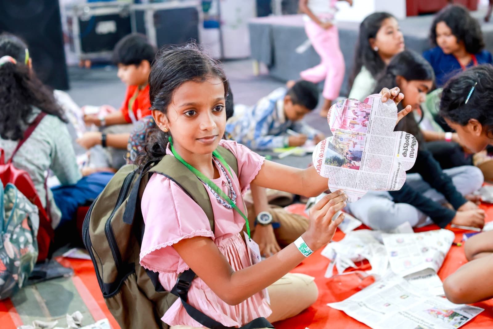 Campers gathered around a fire at dusk