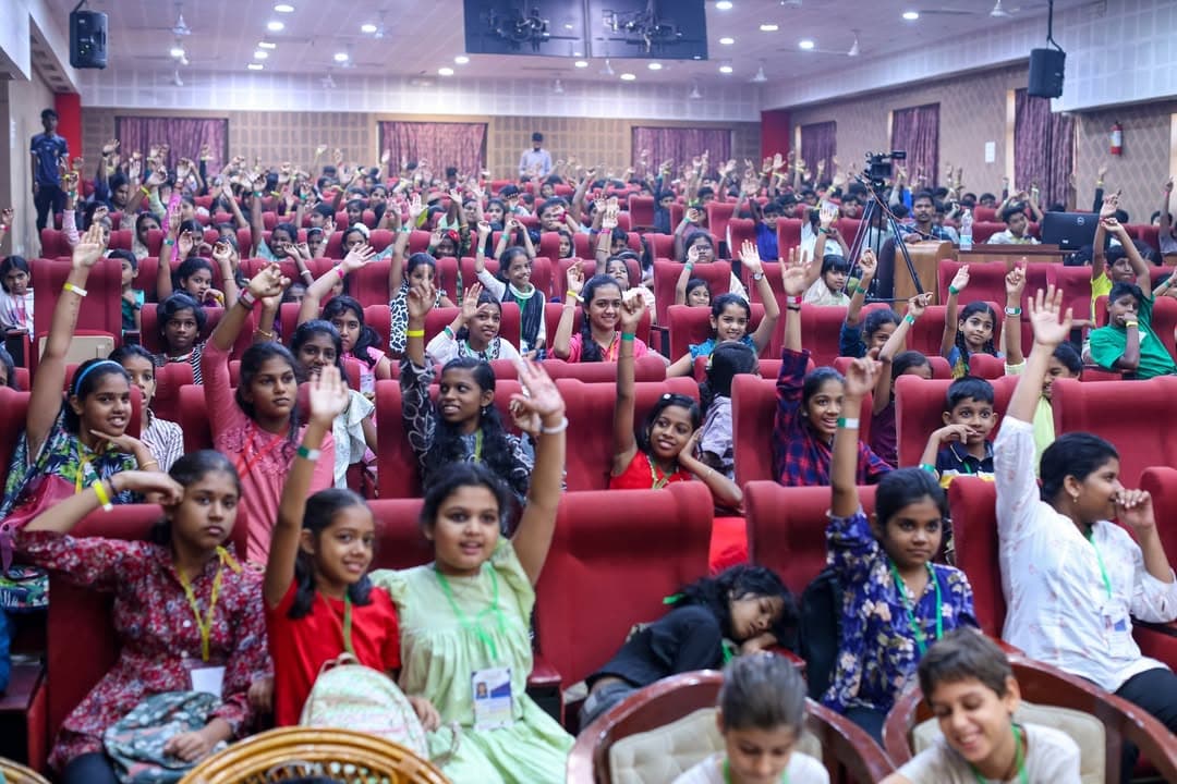 Children raising their hands